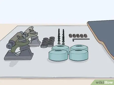 Поставьте грузовики на скейтборд Шаг 1