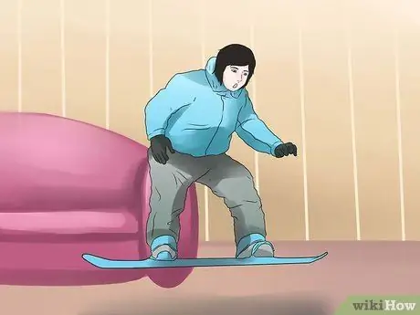 Совершить прыжок на сноуборде Шаг 14