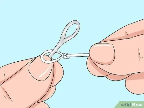 Привяжите леску к лидеру Шаг 11