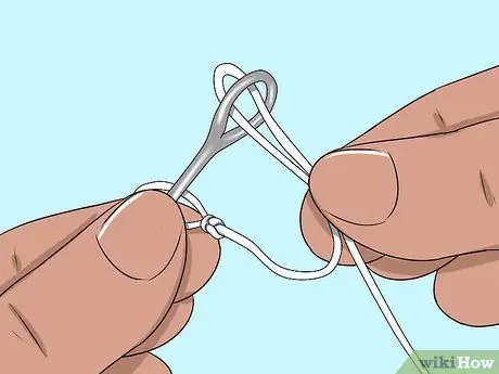 Привяжите трос к поводку Шаг 13