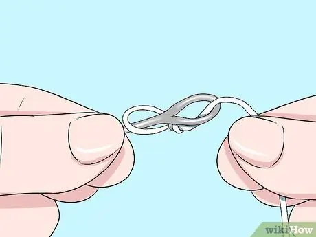 Привяжите леску к лидеру Шаг 15