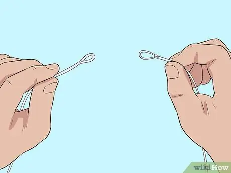 Привяжите трос к поводку Шаг 9