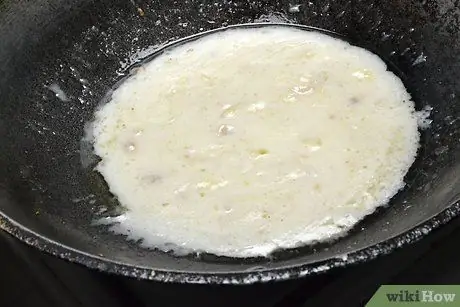 Приготовьте Гинатаанг Тилапия Шаг 7