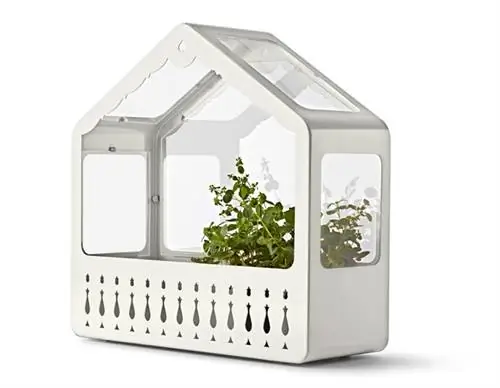 Коттедж - коттедж, который выглядит как швейцарский фермерский дом, может использоваться как кашпо для рассады и теплица, а когда стеклянная половина вывернута наизнанку, он превращается в простой цветочный горшок: 8990